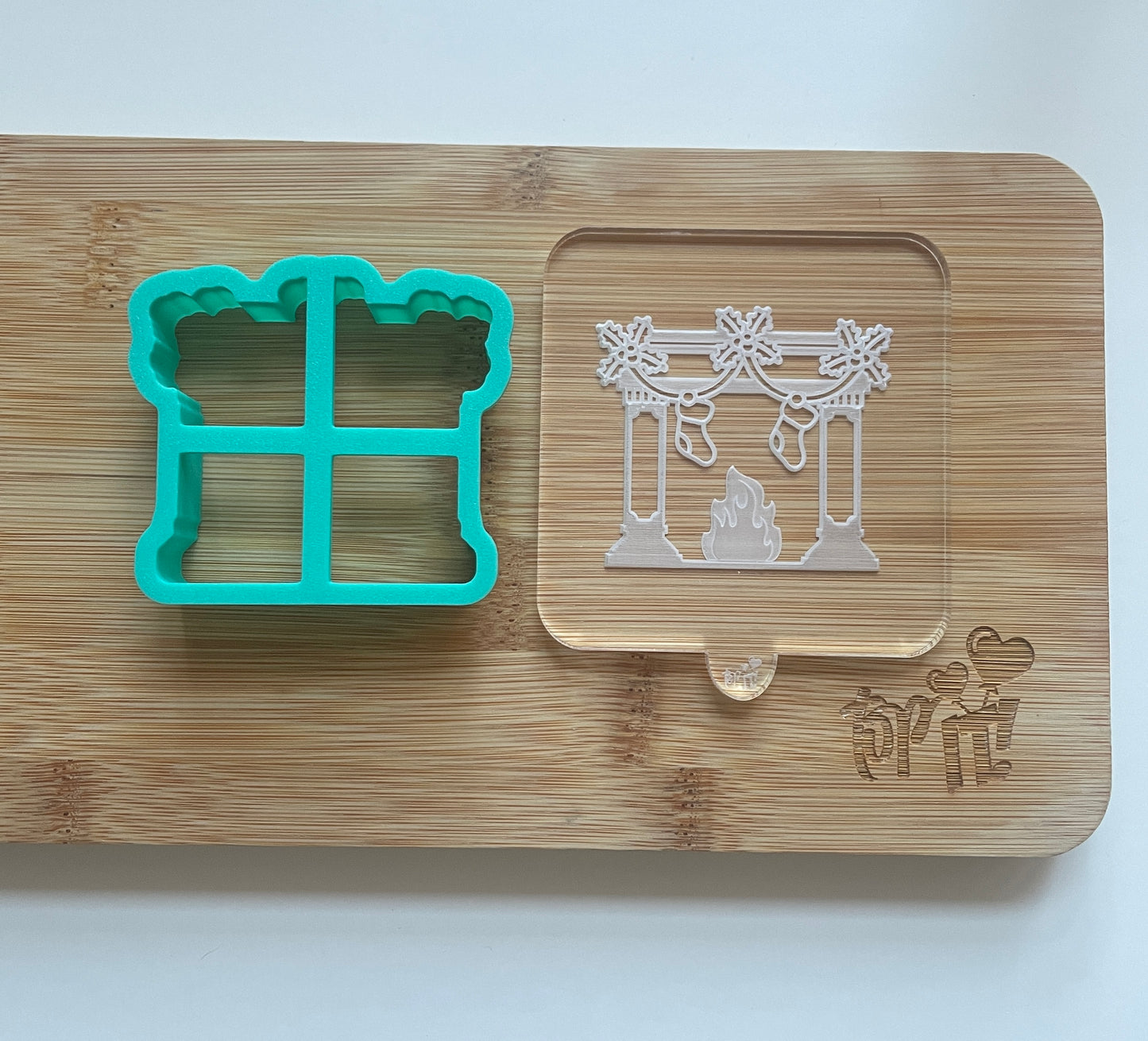 Christmas fireplace with stockings. Debosser.