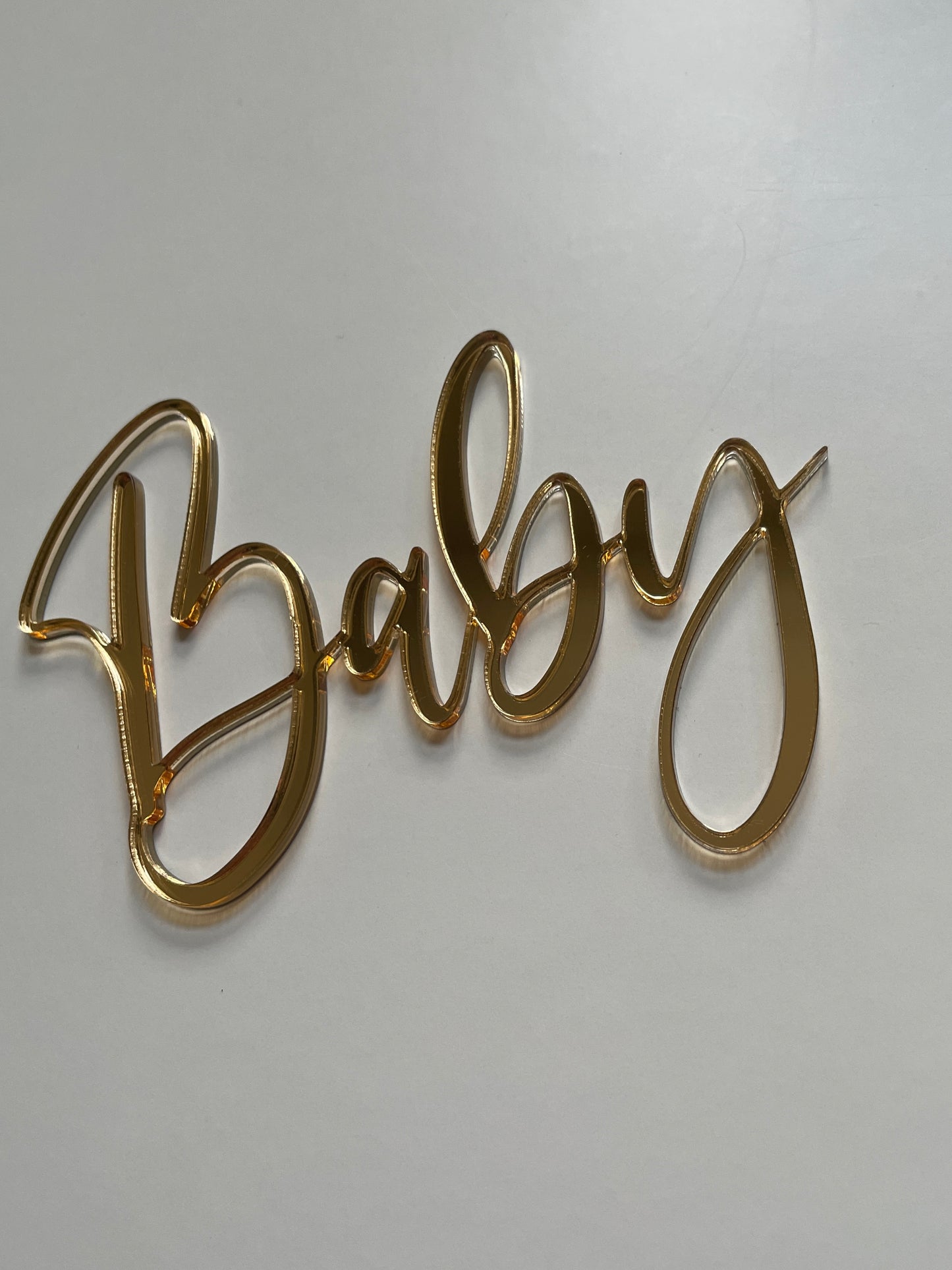 mirrored acrylic baby charm for cakes and sheets cakes. gold or silver