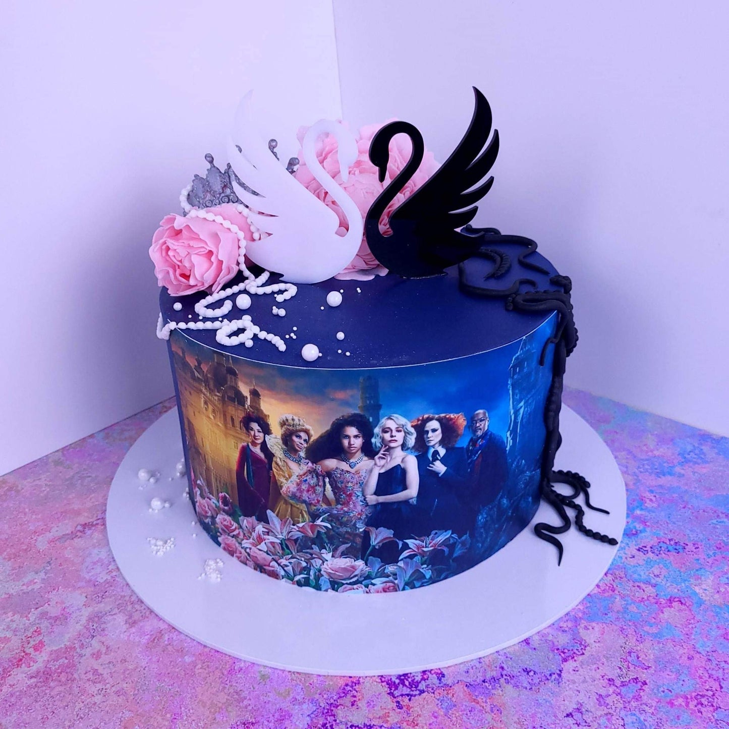 Black and White Acrylic Swans . Approx 3.5 inches wide. Good and Evil theme. Edible icing.