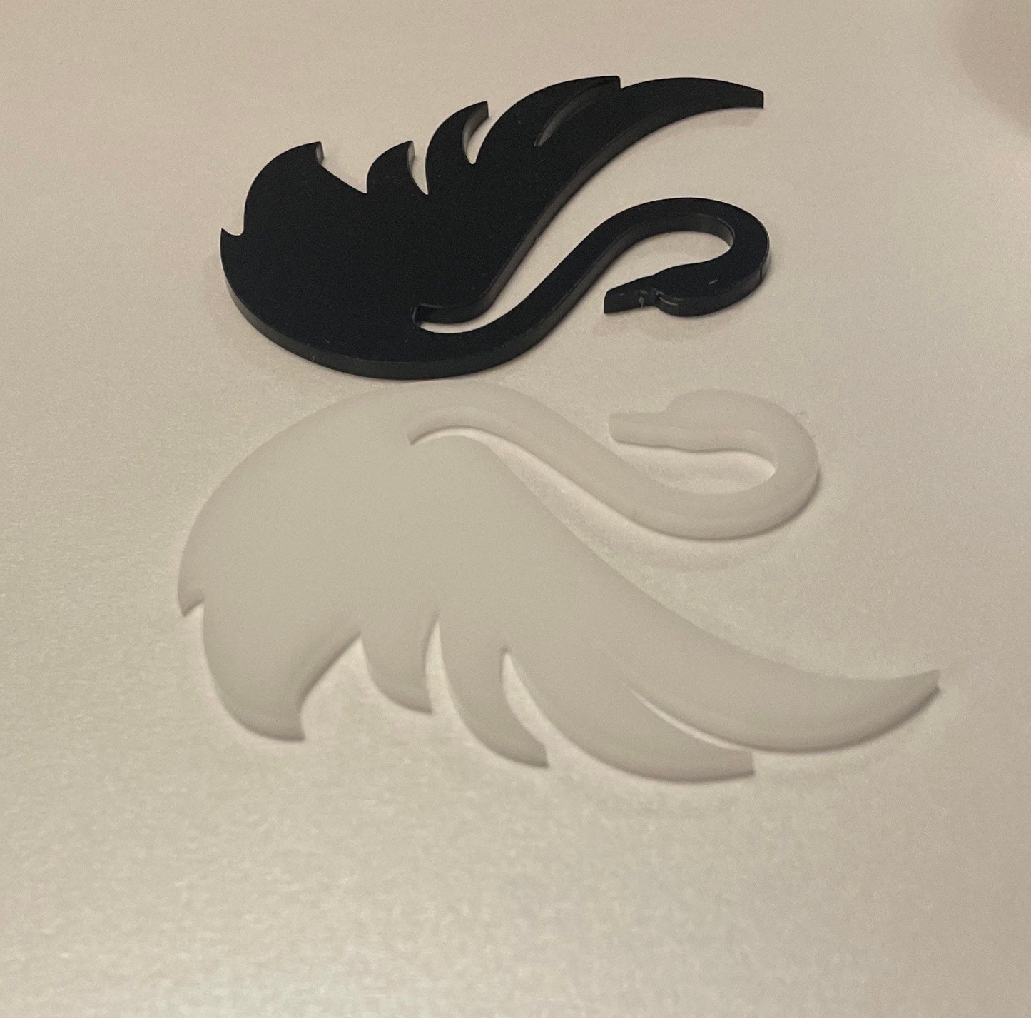 Black and White Acrylic Swans . Approx 3.5 inches wide. Good and Evil theme. Edible icing.