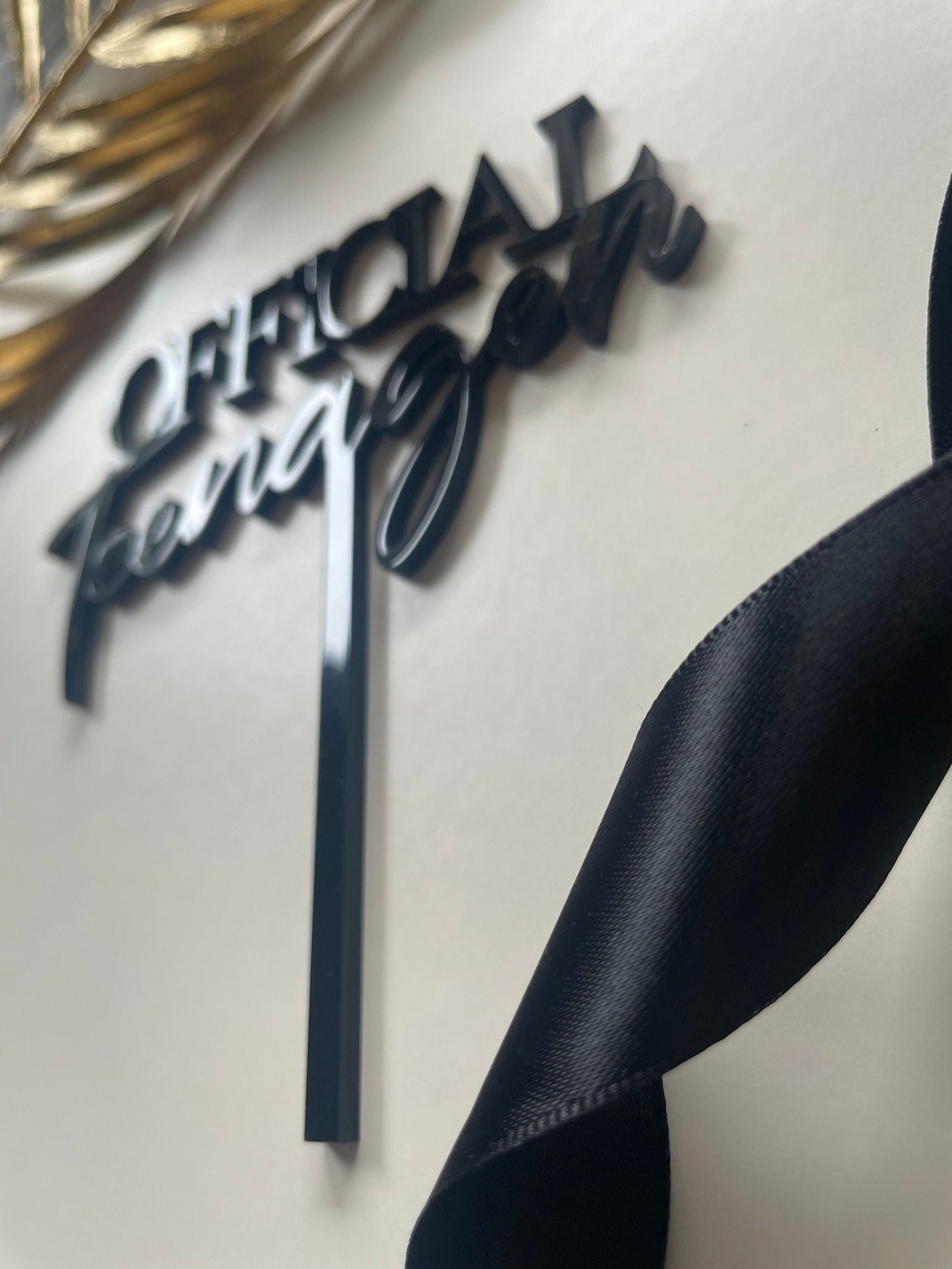 Official teenager acrylic topper.