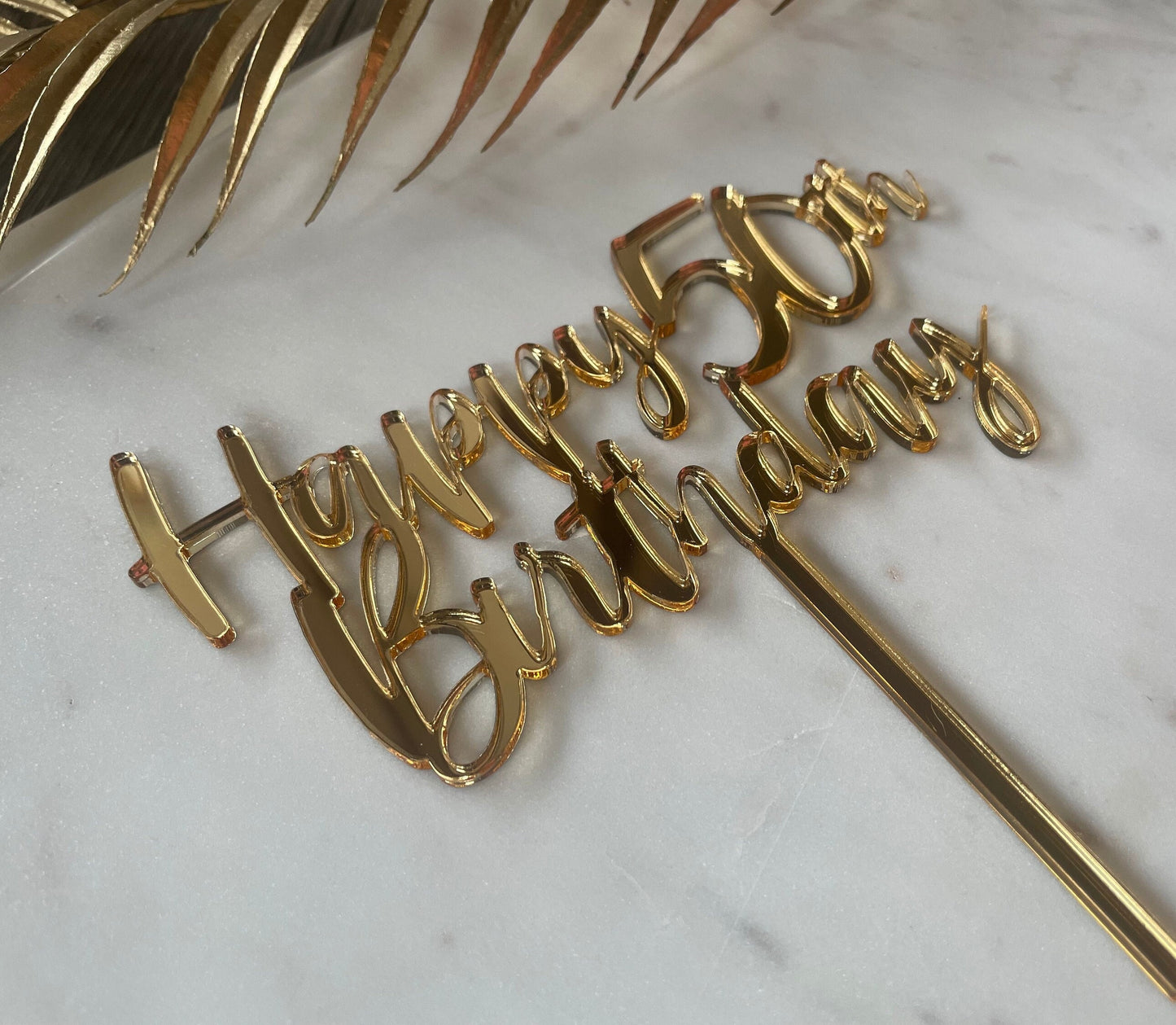 Happy 50th birthday acrylic topper.