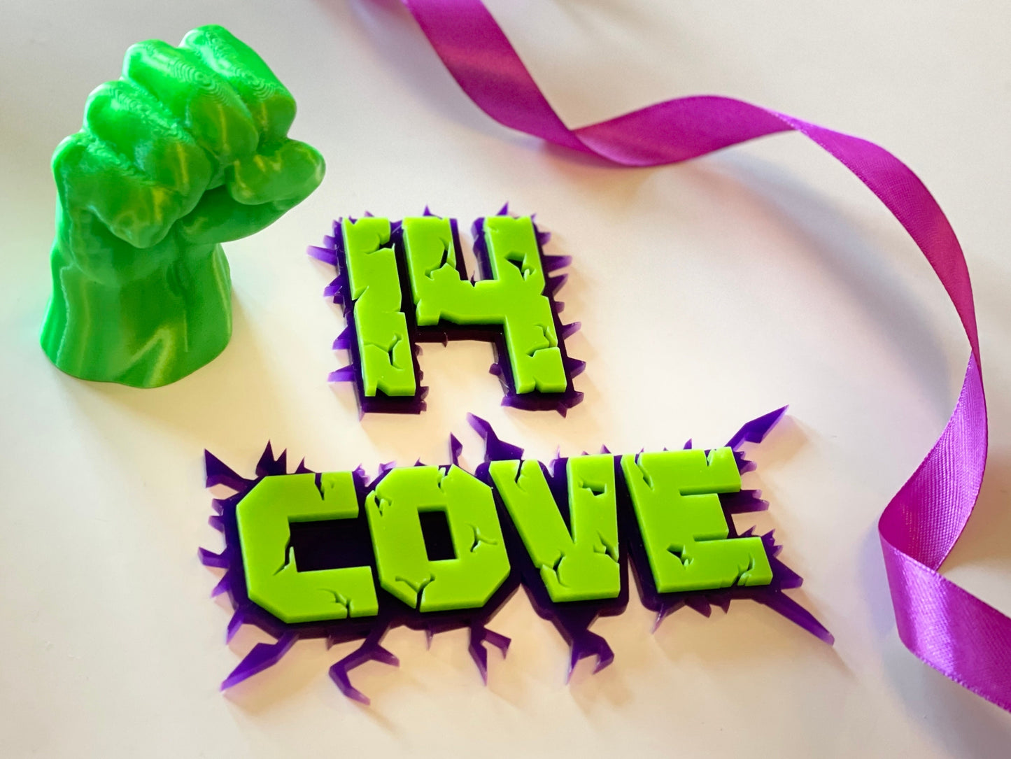 Green and purple acrylic name and age charm. Superhero themed.
