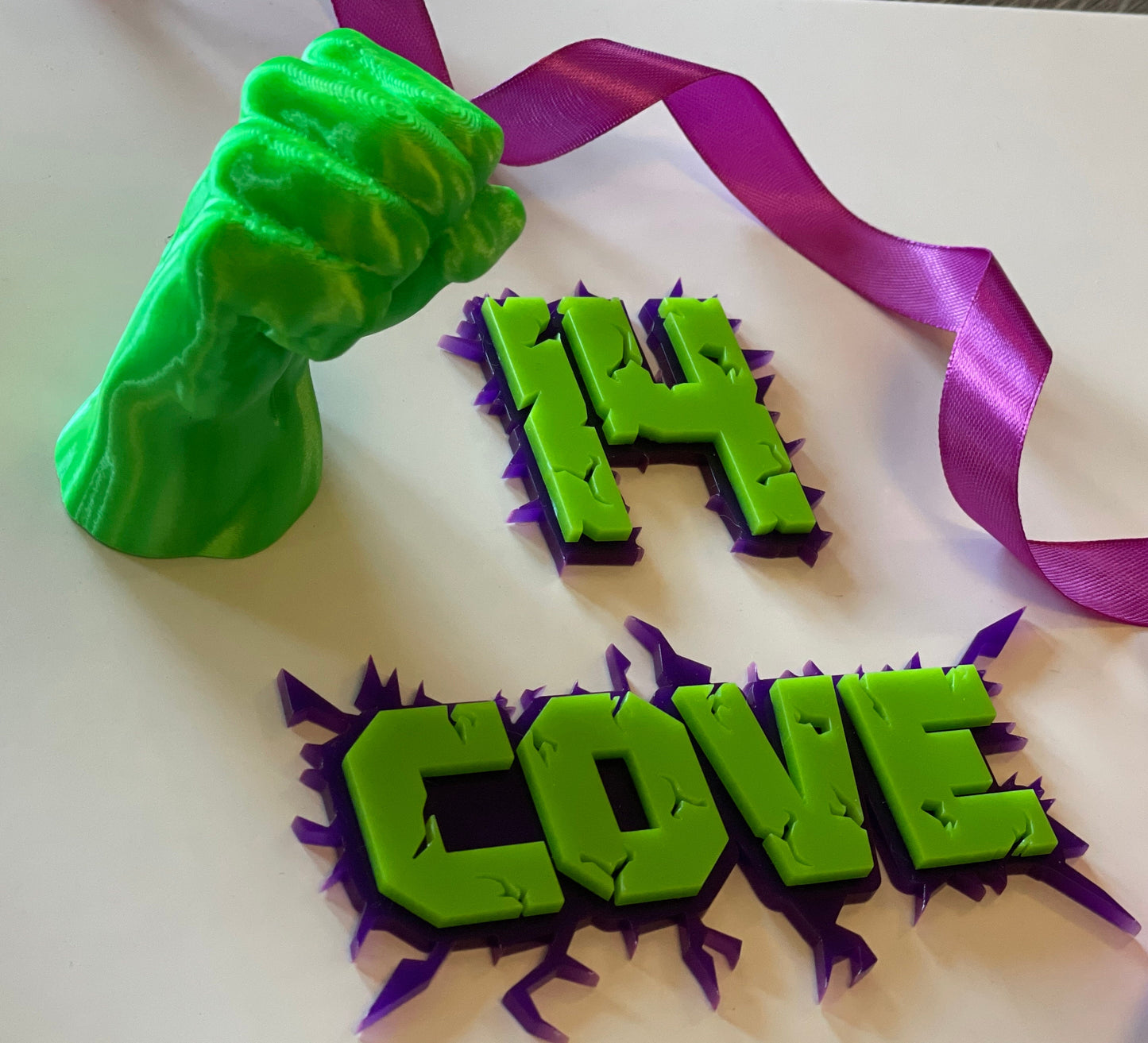 Green and purple acrylic name and age charm. Superhero themed.