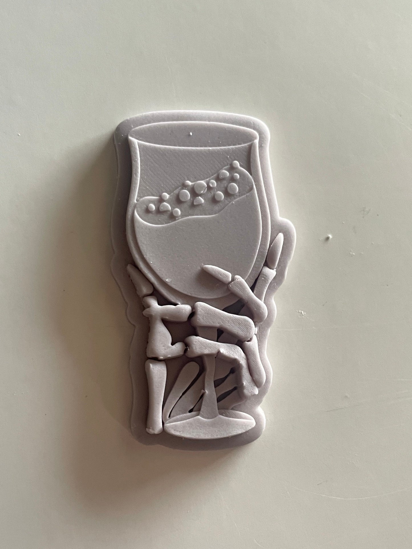 Skeleton Holding Wine Glass | Debosser and cutter set.