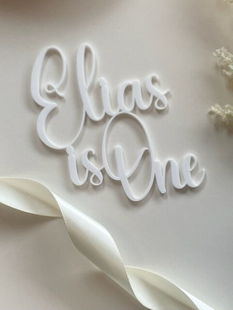 First birthday charm. Name is one.