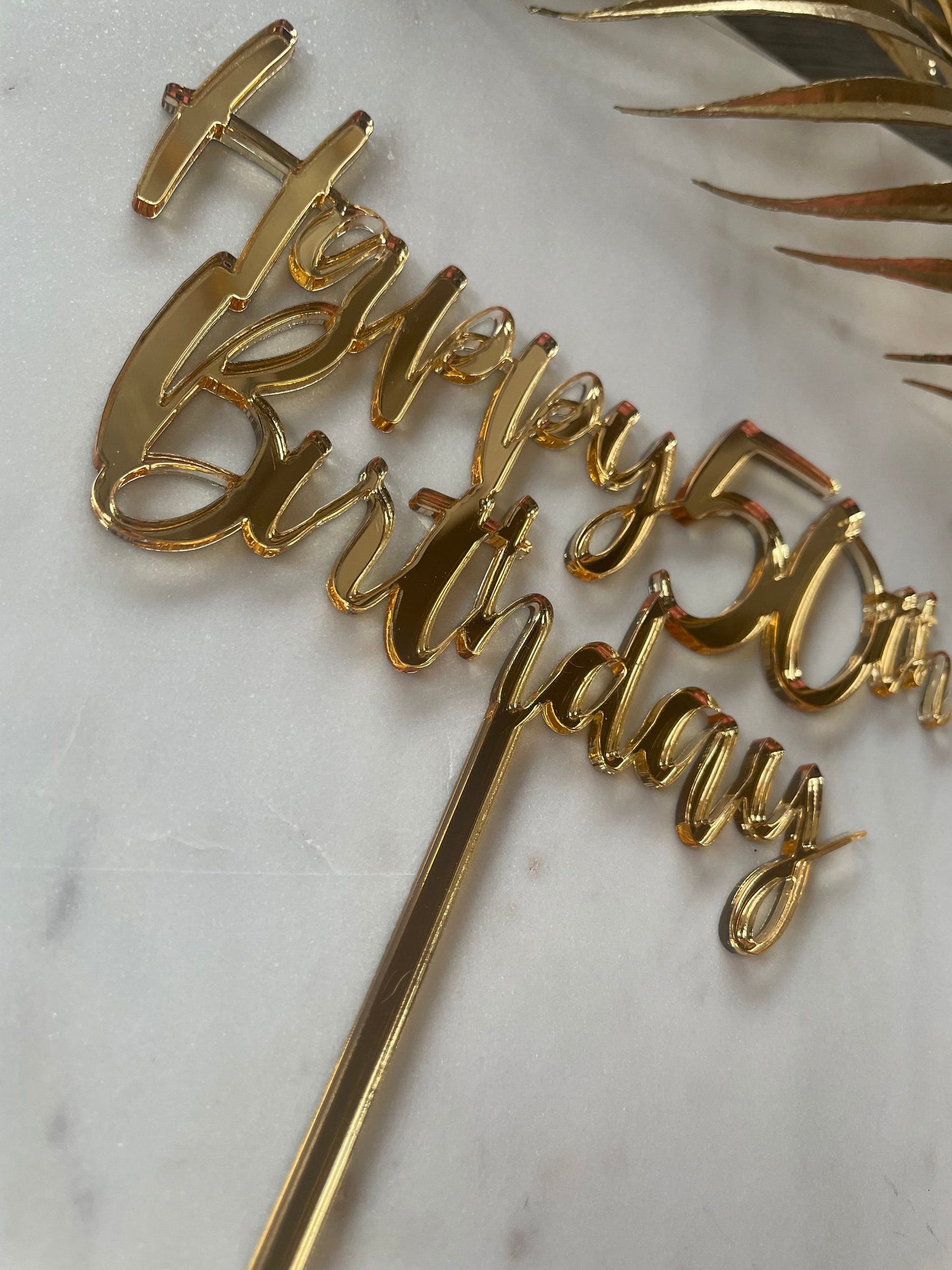 Happy 50th birthday acrylic topper.