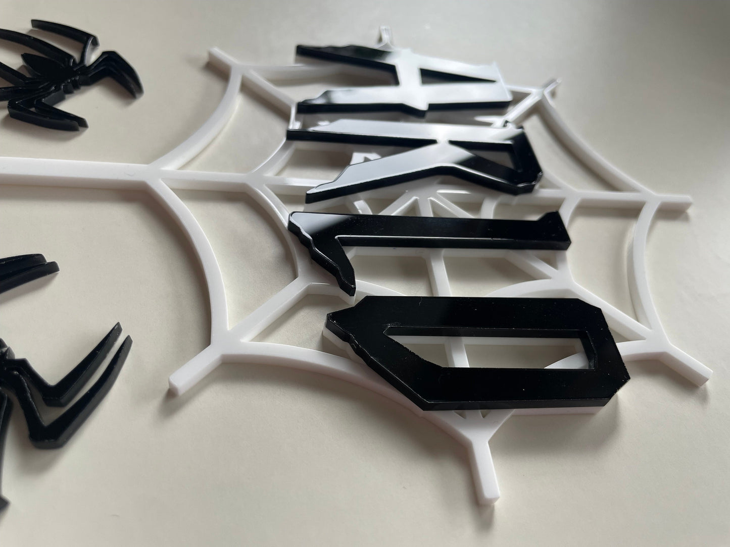 Spider web and spider topper set. Acrylic. Perfect for a spider man fan. Black and white acrylic cake topper set