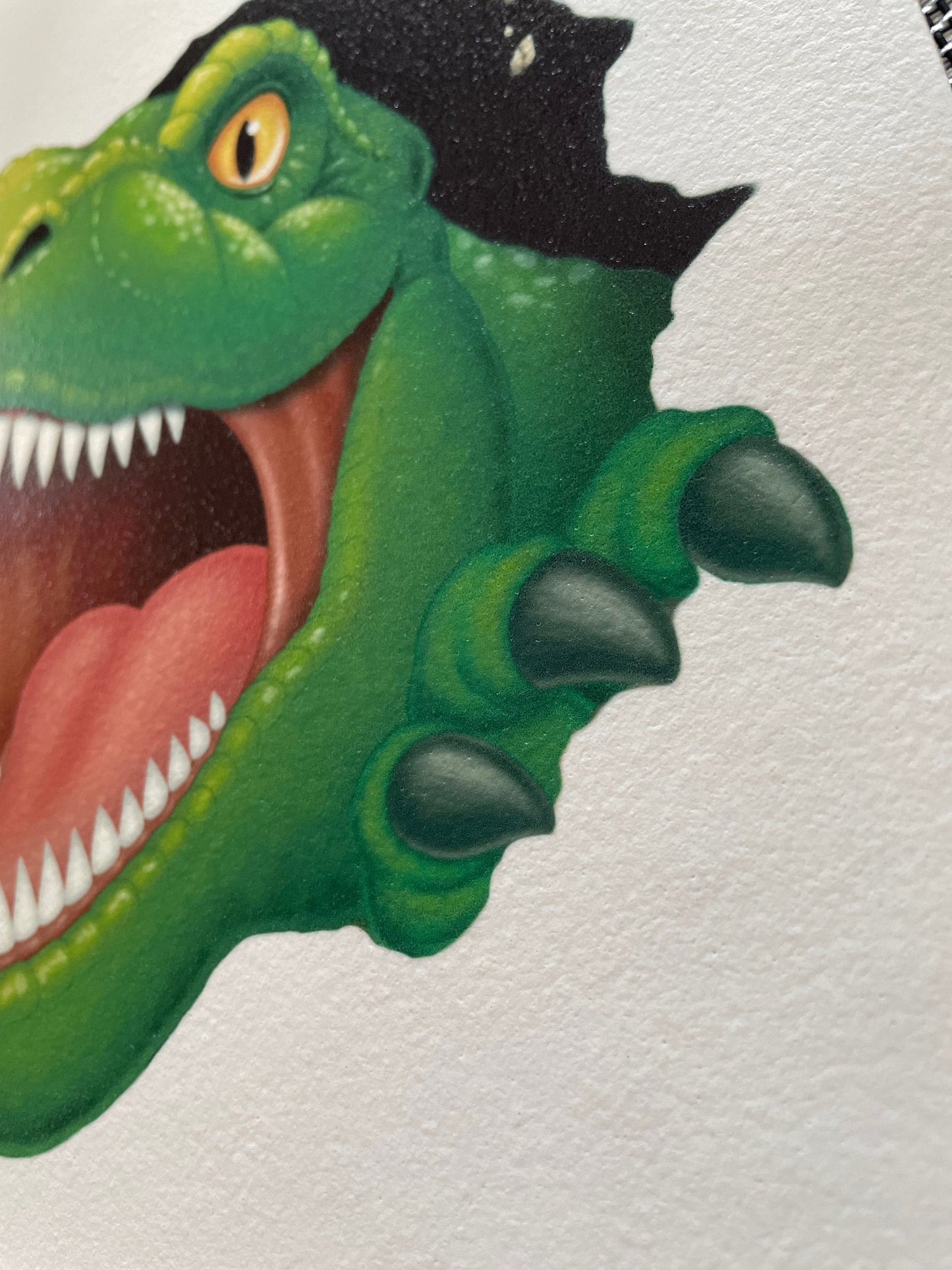T-rex edible icing. Face ripping out of cake. Dinosaur image for cakes.