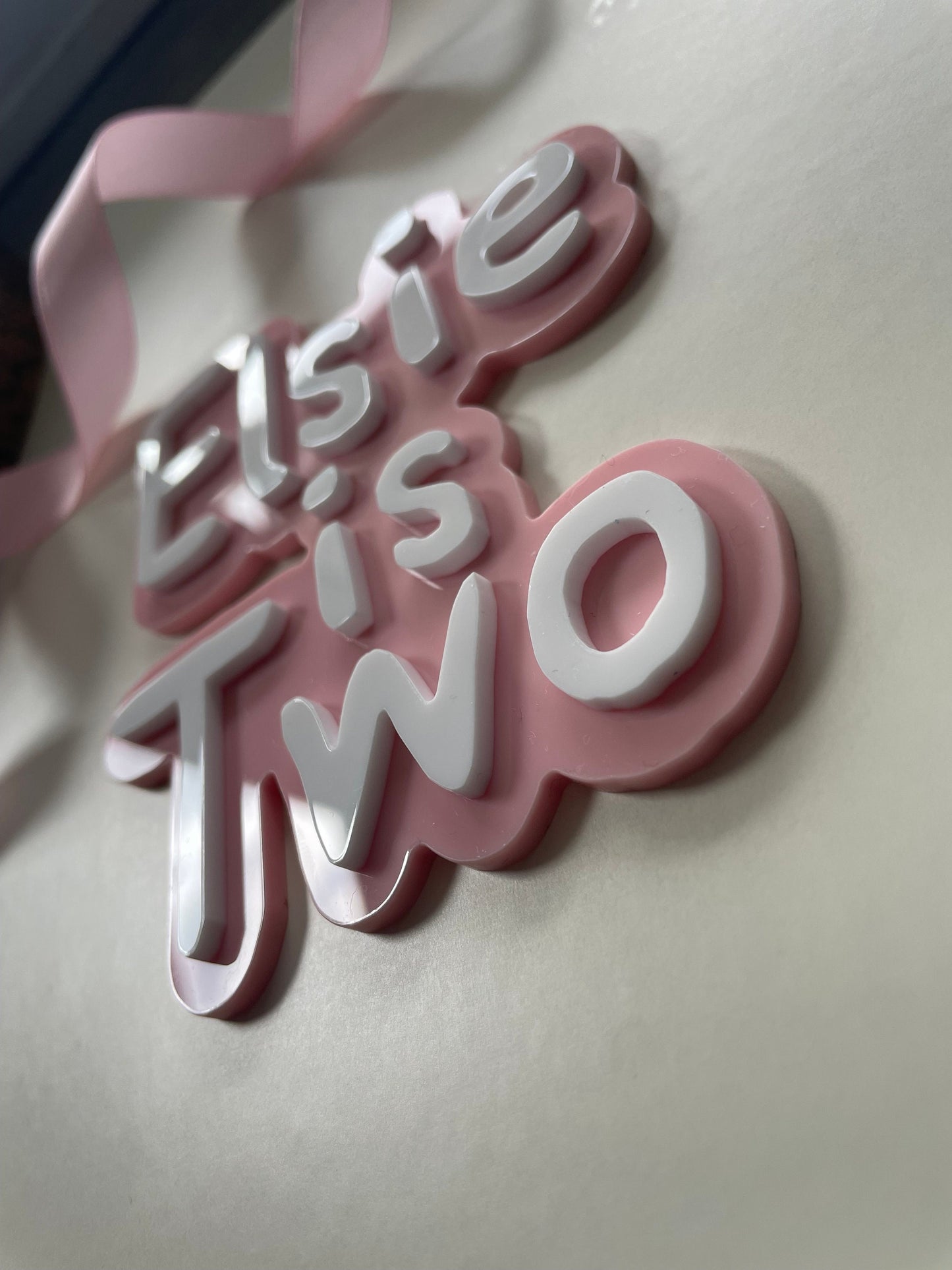 Cute name is age charm. Pink and white acrylic birthday cake charm