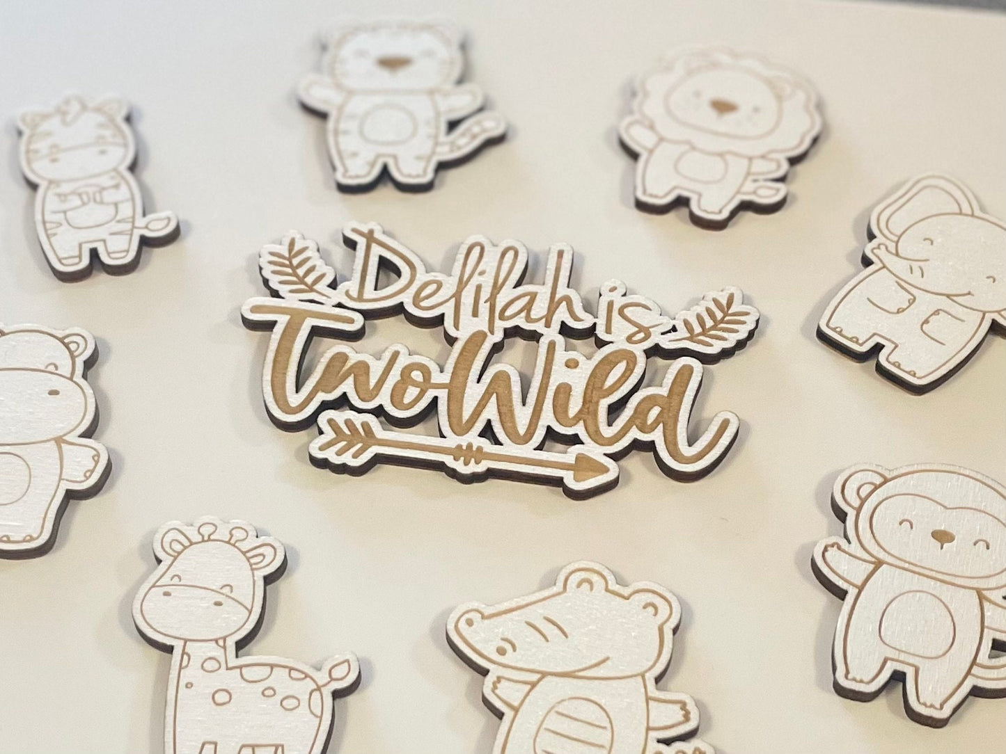 Two wild cake charm. Baby wooden animals