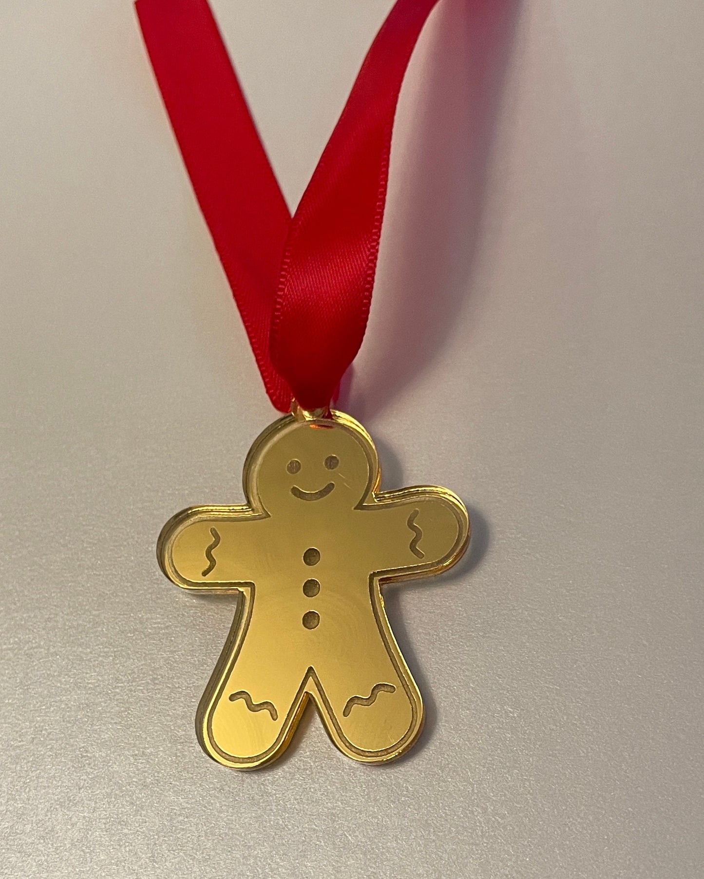 gold gingerbread man tags. Packs of 12.  Mirrored Acrylic