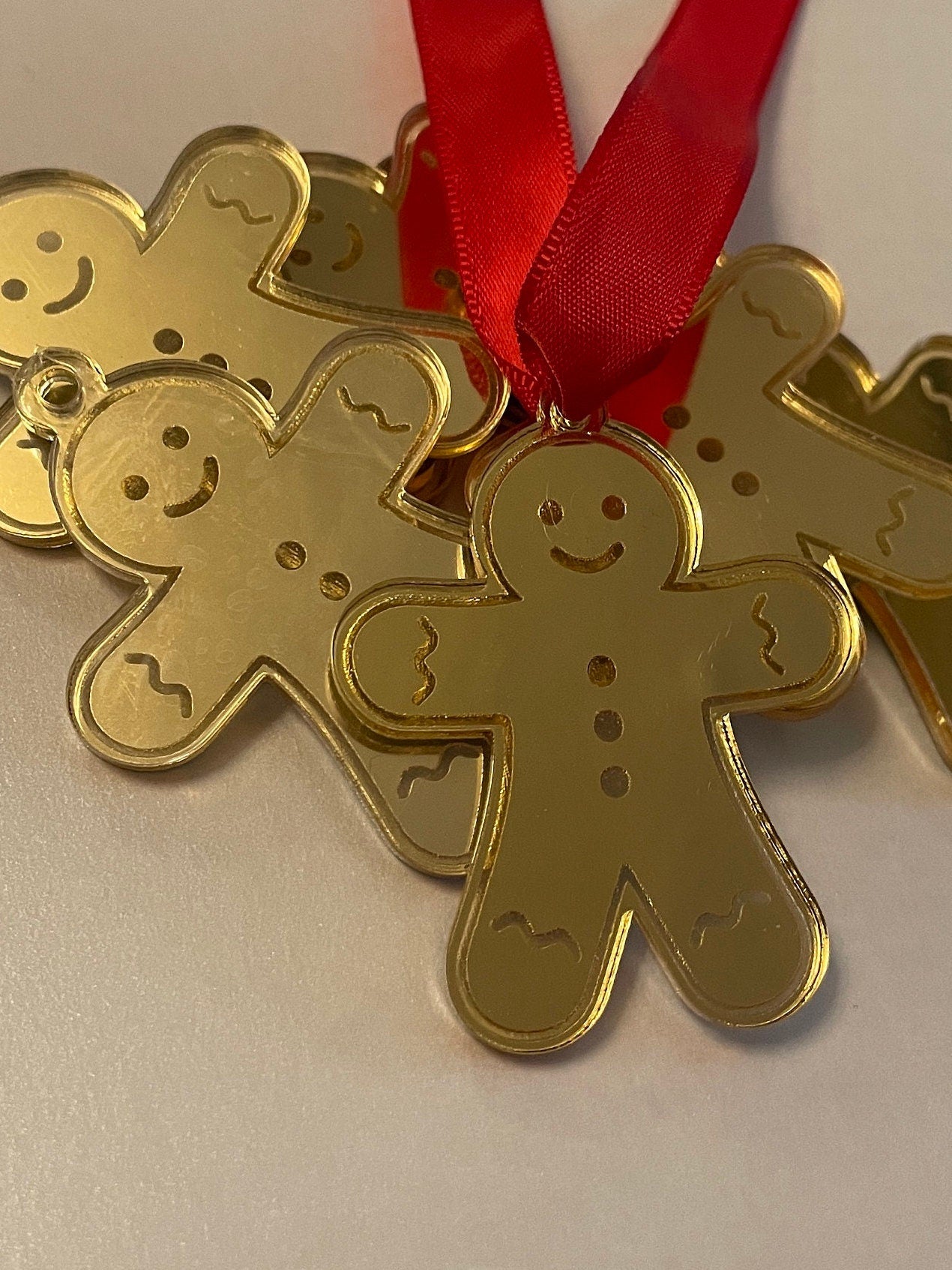 gold gingerbread man tags. Packs of 12.  Mirrored Acrylic